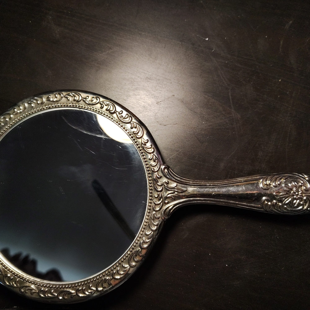 Elegant Silver Handheld Mirror